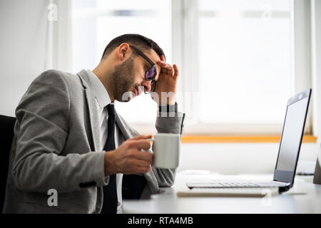 Young businessman is working in office. Stock Photo