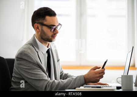 Young businessman is working in office. Stock Photo