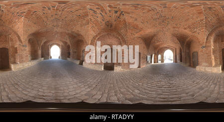 360 degree panoramic view of Gifhorn, Germany, January 20., 2019: Archway made of raw red bricks from the moat to the courtyard of the Gifhorn castle