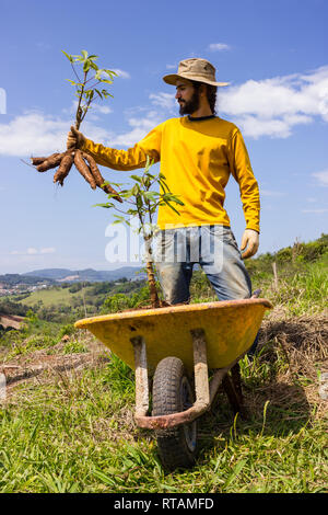 A Happy Smiling Farmer Standing Proudly in a Lush Green Field Wearing a ...