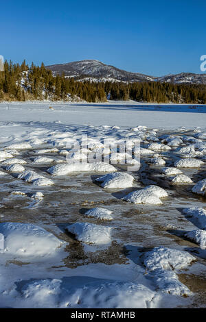 A landscape photo of a cold winter scenic on a clear day in Hauser, Idaho. Stock Photo