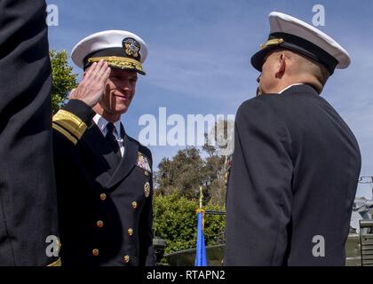 SAN DIEGO (Feb. 01, 2019) Rear Adm. Bill Byrne, Commander, Carrier Strike Group 15,  salutes Capt. Carl E. Meuser during a retirement and change of command ceremony at the U.S. Navy and U.S. Coast Guard Vietnam Memorial on Naval Amphibious Base Coronado. Mueser was relieved by Capt. Jack Killman as commanding officer of EWTGPAC and retired after 30 years of distinguished service. Stock Photo