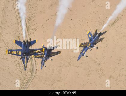 EL CENTRO, Calif. (Feb. 4, 2019) The U.S. Navy Flight Demonstration Squadron, the Blue Angels, diamond pilots perform the diamond dirty roll maneuver over the Imperial Valley during a training flight. The Blue Angels are conducting winter training at Naval Air Facility El Centro, California, in preparation for the 2019 show season. The team is scheduled to conduct 61 flight demonstrations at 32 locations across the country to showcase the pride and professionalism of the U.S. Navy and Marine Corps to the American public. U.S. Navy Stock Photo