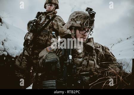 Soldiers demonstrate part of the Fire and Movement stage in the British ...