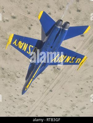 EL CENTRO, Calif. (Feb. 6, 2019) The Blue Angels' flight leader and commanding officer, Capt. Eric Doyle, performs the double farvel maneuver during a training flight over the Imperial Valley. The Blue Angels are conducting winter training at Naval Air Facility El Centro, California, in preparation for the 2019 show season. The team is scheduled to conduct 61 flight demonstrations at 32 locations across the country to showcase the pride and professionalism of the U.S. Navy and Marine Corps to the American public. Stock Photo