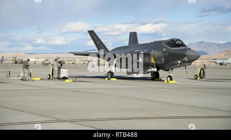 Crew chiefs with the 4th Aircraft Maintnenace Unit prepare to recover F35A Lightning II fighter jets during Red Flag 19-1, Nelllis Air Force Base, Nevada, Feb. 6, 2019. Pilots and maintainers from the 388th Fighter Wing's 4th Fighter Squadron and 4th Aircraft Maintenance Unit are participating in Red Flag 19-1 at Nellis AFB, Nevada. This is the wing's second Red Flag with the F-35A, America's most advanced multi-role fighter, which brings game-changing stealth, lethality and interoperability to the modern battlefield. Red Flag is the Air Force's premier combat exercise and includes units from  Stock Photo