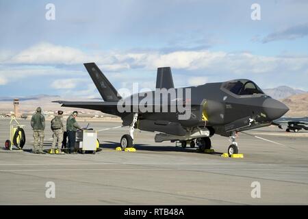 Crew chiefs with the 4th Aircraft Maintnenace Unit prepare to recover F35A Lightning II fighter jets during Red Flag 19-1, Nelllis Air Force Base, Nevada, Feb. 6, 2019. Pilots and maintainers from the 388th Fighter Wing's 4th Fighter Squadron and 4th Aircraft Maintenance Unit are participating in Red Flag 19-1 at Nellis AFB, Nevada. This is the wing's second Red Flag with the F-35A, America's most advanced multi-role fighter, which brings game-changing stealth, lethality and interoperability to the modern battlefield. Red Flag is the Air Force's premier combat exercise and includes units from  Stock Photo