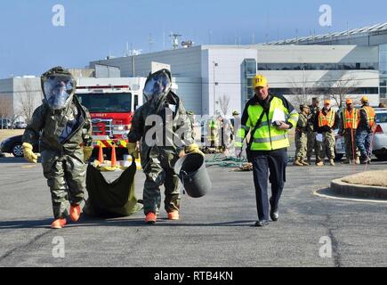 NAS PATUXENT RIVER, Maryland (Feb. 6, 2019) - Members of NAS Patuxent River's Fire Department prepare to enter the Center Stage Theater during a hazmat drill for the Citadel Shield/Solid Curtain 2019 exercise. Conducted by Commander, U.S. Fleet Forces Command and Commander, Navy Installations Command, the two-week, two-part exercise uses realistic drills and scenarios to enhance the readiness of Navy security forces and ensure seamless interoperability among the tenant commands, fire and medical services, and agency partners. Stock Photo