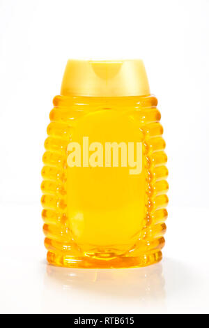Honey bottle isolated on white background Stock Photo