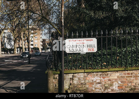 London, UK - February 23, 2019: Campden Hill Square street name sign on a black fence in The Royal Borough of Kensington and Chelsea, an affluent area