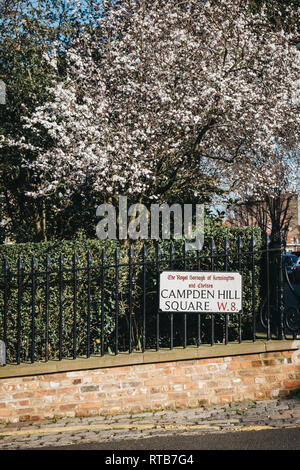 London, UK - February 23, 2019: Campden Hill Square street name sign on a black fence in The Royal Borough of Kensington and Chelsea, an affluent area