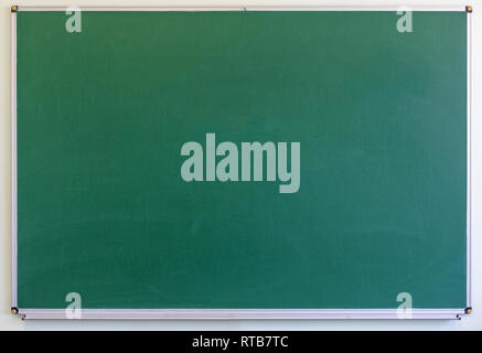Blackboard with wooden frame, dirty chalkboard. Green color Stock Photo