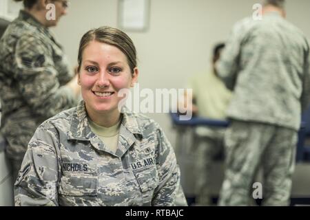 I met Airman 1st Class Nichols while she was taking my routine blood test.    “I am an Aerospace Medical Technician, and I am a nursing student. The process in joining the military was really smooth; I decided I wanted to join the military for educational benefits and then it just so happened the med tech career was available and I thought, 'that is perfect.' So far, my time has been great in the med tech position, even though the tech school is a little long. But it is needed to prepare us for everything we have to do. It is making my civilian career a little easier, and to know it ahead of t Stock Photo