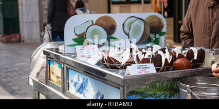 February 19, 2019. Athens Greece, city center. Outdoor coconut market stall at Ermou pedestrian street. Stock Photo