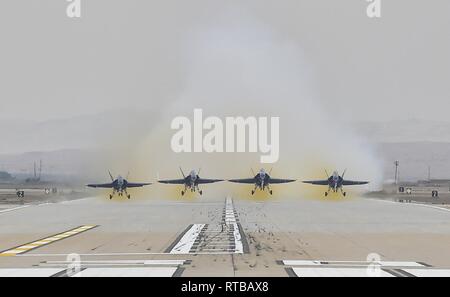 EL CENTRO, Calif. (Feb. 2, 2019) The U.S. Navy Flight Demonstration Squadron, the Blue Angels, Diamond pilots take off for a training flight at Naval Air Facility (NAF) El Centro. The Blue Angels are conducting winter training at NAF El Centro, California, in preparation for the 2019 show season. The team is scheduled to conduct 61 flight demonstrations at 32 locations across the country to showcase the pride and professionalism of the U.S. Navy and Marine Corps to the American public. Stock Photo