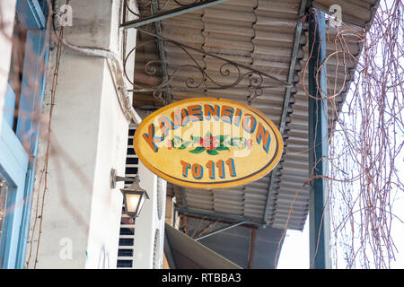 February 19, 2019. Athens Greece, Monastiraki, Plaka area, Vintage shop signboard hanging out of an old cafe Stock Photo
