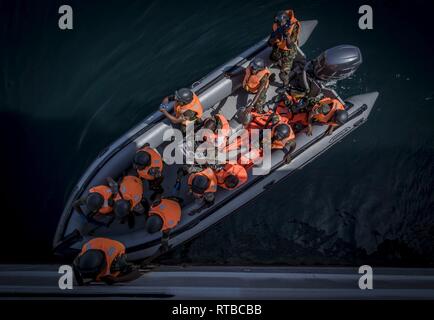 PEMBA, Mozambique (Feb. 3, 2019) Military members from the Tanzania People's Defence Force board the French patrol ship Le Malin (P 701) during a visit, board, search and seizure drill while participating in exercise Cutlass Express 2019 in Pemba, Mozambique, Feb. 3, 2019. Cutlass Express is designed to improve regional cooperation, maritime domain awareness and information sharing practices to increase capabilities between the U.S., East African and Western Indian Ocean nations to counter illicit maritime activity. Stock Photo