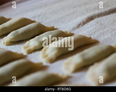 filled surface of ravioli with spinach and ricotta handmade ready to be cooked in boiling water, typical South Tyrolean recipe Stock Photo