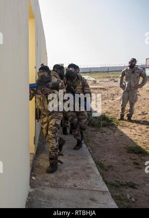 Moroccan special operations forces demonstrate how to clear a building while a U.S. Marine with Special Purpose Marine Air-Ground Task Force-Crisis Response-Africa 19.1, Marine Forces Europe and Africa, supervises during a theater-security cooperation event in Tifnit, Morocco, Feb. 7, 2019. SPMAGTF-CR-AF is a rotational force deployed to conduct crisis-response and theater-security operations in Europe and Africa. Stock Photo