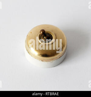Vintage porcelain and brass switch Stock Photo