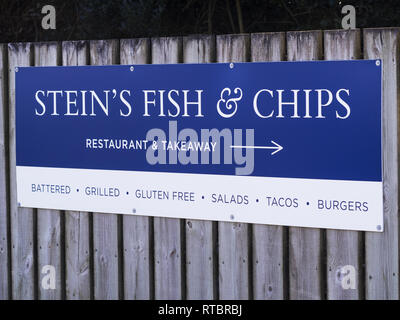 Direction sign for Rick Stein's fish and chip shop, Padstow, Cornwall, UK Stock Photo