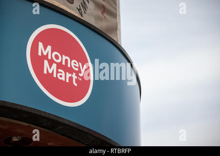OTTAWA, CANADA - NOVEMBER 11, 2018: Money Mart logo in front of their boutique in Ottawa, Ontario. Money Mart is a personal finance retailer specializ Stock Photo