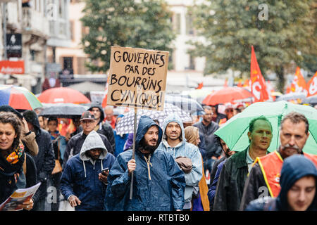 STRASBOURG, FRANCE - SEPT 12, 2017: Gouverne par des bourrins cyniques translated as governed by cynical bushes at male protest placard at anti-macron protest in France Stock Photo