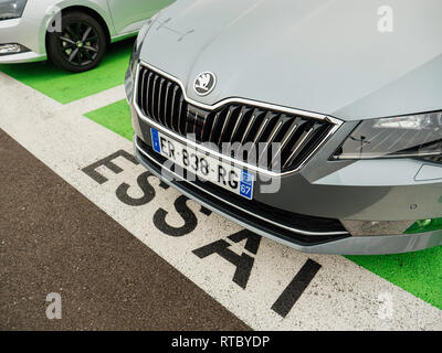 PARIS, FRANCE - NOV 7, 2017: Essai text translated as Test Drive cars with Skoda Superb luxury car made by Volkswagen at the car dealership garage Stock Photo