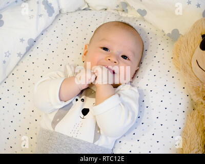 Close-up portrait cute little mixed race Asian and Caucasian baby son sleeping on back. Daytime sleeping. Family, healthy birth concept photo Stock Photo