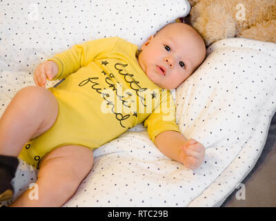 Close-up portrait cute little mixed race Asian and Caucasian baby son sleeping on back. Daytime sleeping. Family, healthy birth concept photo Stock Photo