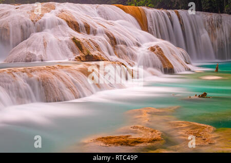 Turquoise waters of the Agua Azul cascades and waterfalls in the Chiapas rainforest, also used as swimming pools, near the city of Palenque, Mexico. Stock Photo