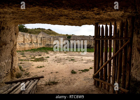 Ancient Italian cave church view from inside out. This ruined religious place is known as Chiesa di San Falcione and is close to Matera, Basilicata re Stock Photo