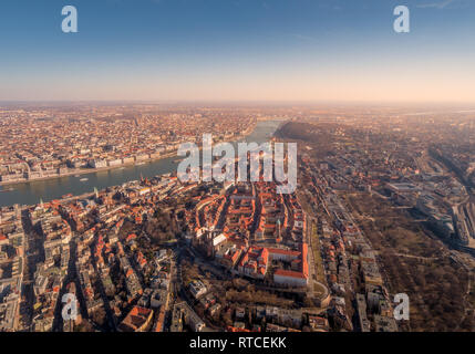 Image of areal view over the Hungarian capital city of Budapest with the river of danube and historical buildings and bridges during sunset