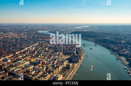 Image of areal view over the Hungarian capital city of Budapest with the river of danube and historical buildings and bridges during sunset