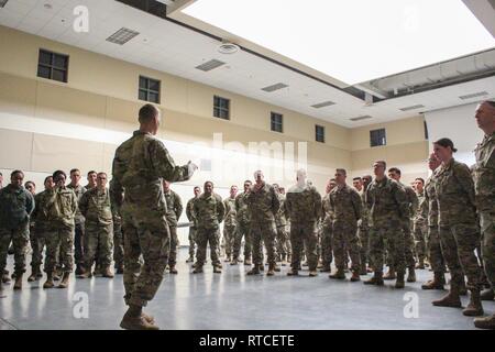 U.S. Army Col. Dave Zinn, commander of the 2nd Infantry Brigade Combat Team, 4th Infantry Division, talks to the Soldiers of Alpha Company, 52nd Brigade Engineer Battalion, 2IBCT, Feb. 15, 2019, as they prepare to depart to provide military support to the Department of Homeland Security and U.S. Customs and Border Protection to secure the southwest border of the United States. Stock Photo