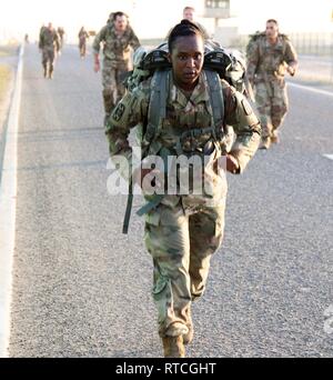 U.S. Army Sgt. 1st Class 335th Signal Command (T) (P), marches during the Presidents Day 10K Ruck Sack March at Camp Arifjan, Kuwait, Feb. 18, 2019. The event is held in honor of George Washington, the first President of the United States. The event is in line with the Army's modernization strategy to make Soldiers and units more lethal to win our nation's wars, them come home safely. Stock Photo