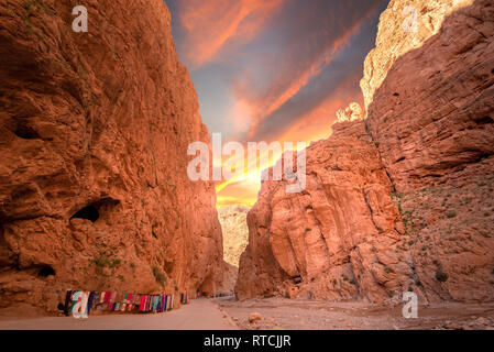 Todgha Gorge or Gorges du Toudra is a canyon in High Atlas Mountains near the town of Tinerhir, Morocco . A series of limestone river canyons sunset Stock Photo