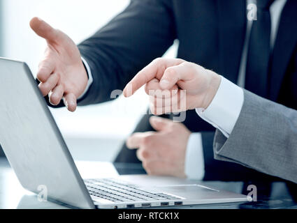 close up. two business people discussing online information Stock Photo