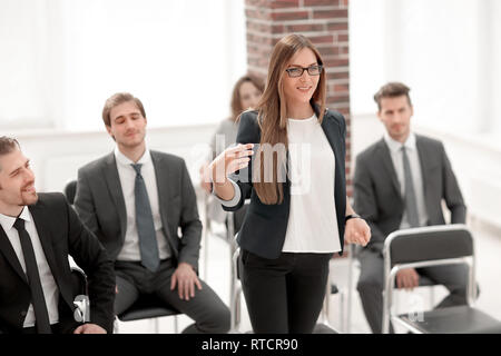 Businesswoman Addressing Delegates At Conference Stock Photo