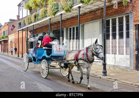 NEW ORLEANS, LA -26 JAN 2019- View of a traditional horse-drawn carriage in the French Quarter of New Orleans, Louisiana. Stock Photo