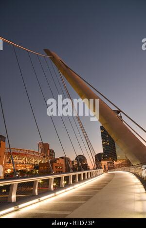 The iconic, modern 500-feet long Harbor Drive Pedestrian Bridge at sunrise, connects Petco Park to San Diego Bay and Convention Center, San Diego, USA