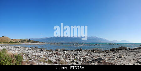 High resolution panoramic over Kaikoura bay looking to Kaikoura mountain range showing raised foreshore after earthquake, New Zealand South Island Stock Photo