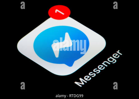 A close-up shot of the Facebook Messenger app icon, as seen on the screen of a smart phone (Editorial use only) Stock Photo