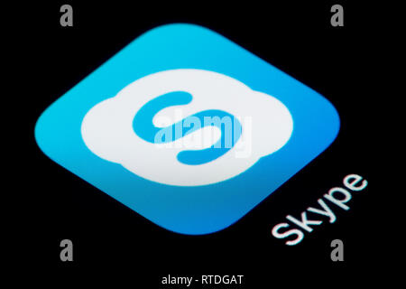 A close-up shot of the Skype app icon, as seen on the screen of a smart phone (Editorial use only) Stock Photo