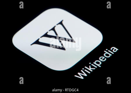 A close-up shot of the Wikipedia app icon, as seen on the screen of a smart phone (Editorial use only) Stock Photo