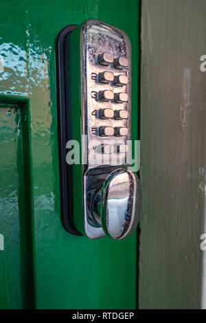 Closeup of Digital Keypad Door Lock on Green door Stock Photo