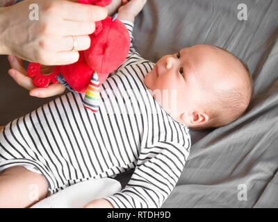 Close-up portrait cute little mixed race Asian and Caucasian baby son sleeping on back. Daytime sleeping. Family, healthy birth concept photo Stock Photo