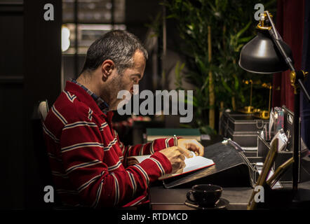 Man working in the study room Stock Photo