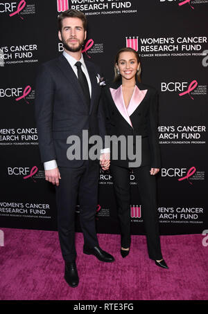 Beverly Hills, California, USA. 28th Feb, 2019. LIAM HEMSWORTH and MILEY CYRUS at The Women's Cancer Research Fund's An Unforgettable Evening Benefit Gala held at Beverly Wilshire Four Seasons Hotel. Credit: Birdie Thompson/AdMedia/ZUMA Wire/Alamy Live News Stock Photo