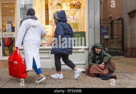 Preston, Lancashire. 1st March 2019. UK Weather. Cold, damp inclement day for Gary in the town centre as Preston’s homeless people hope for donations on the city centre streets. Trapped in the social system by having no fixed abode, they are unable to claim Universal Credit and resort to begging to hopefully acquire cash from passing shoppers, enough for a overnight hostel. Credit. MWI/AlamyLiveNews. Stock Photo